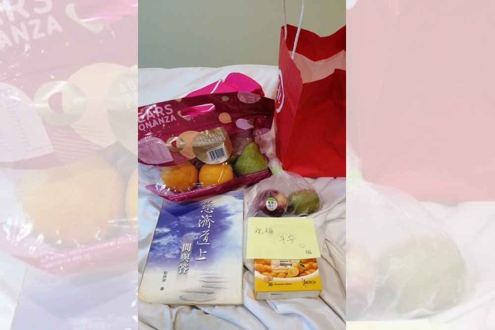 Several items delivered by Ms Lim, including fruits, vitamins and a book. (Photo by Tang Siew Yee)